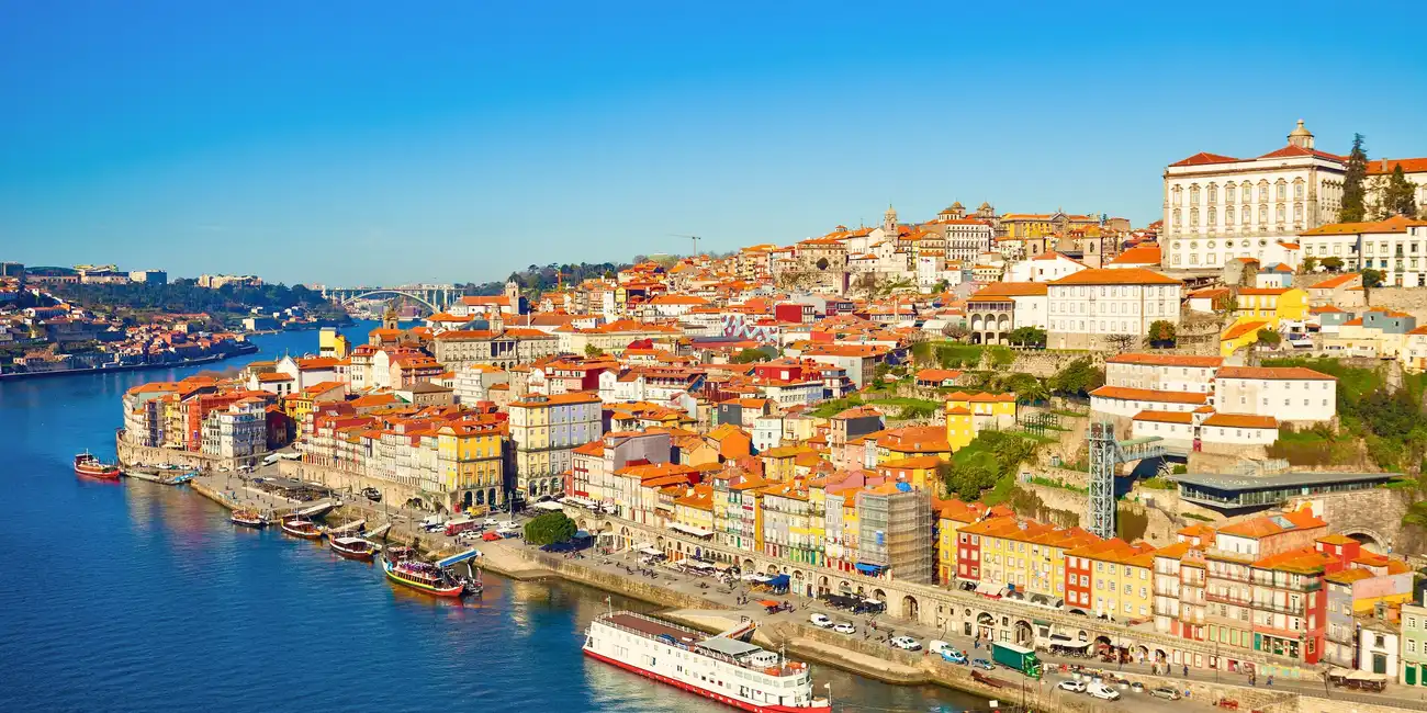 View of the Douro River and Old Town in Porto, Portugal, showcasing stunning scenery and historical landmarks - Best Things to Do in Porto with Porto Pass.